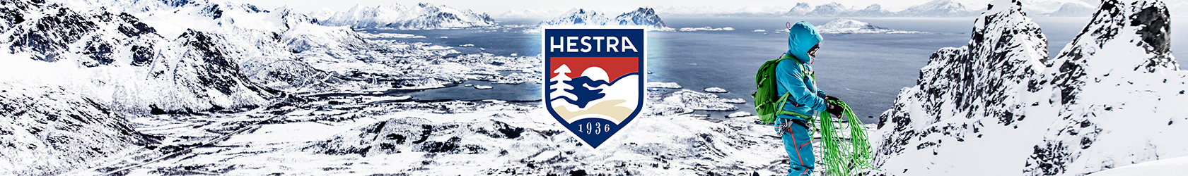 A person, wearing Hestra gloves, is preparing to climb snow mountains.
