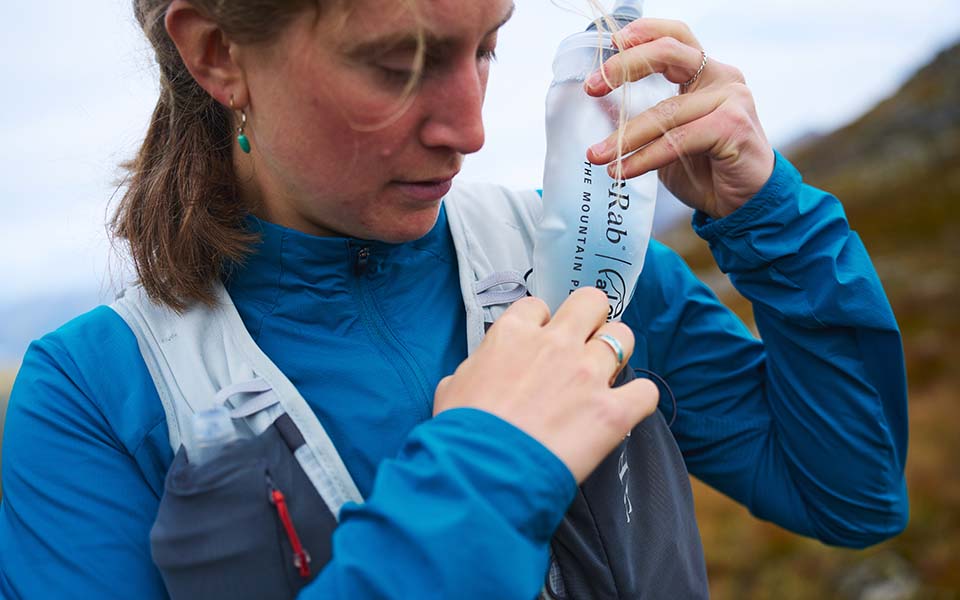 woman wearing rab equipment and clothing