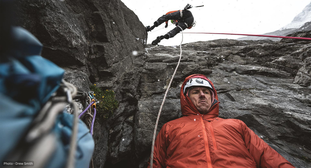 Josh Wharton and Vince Anderson get down together on Jirishanca. Huayhuash Mountains, Peru. One abseils in the background while one stares far past the camera in the foreground - Photo by Drew Smith