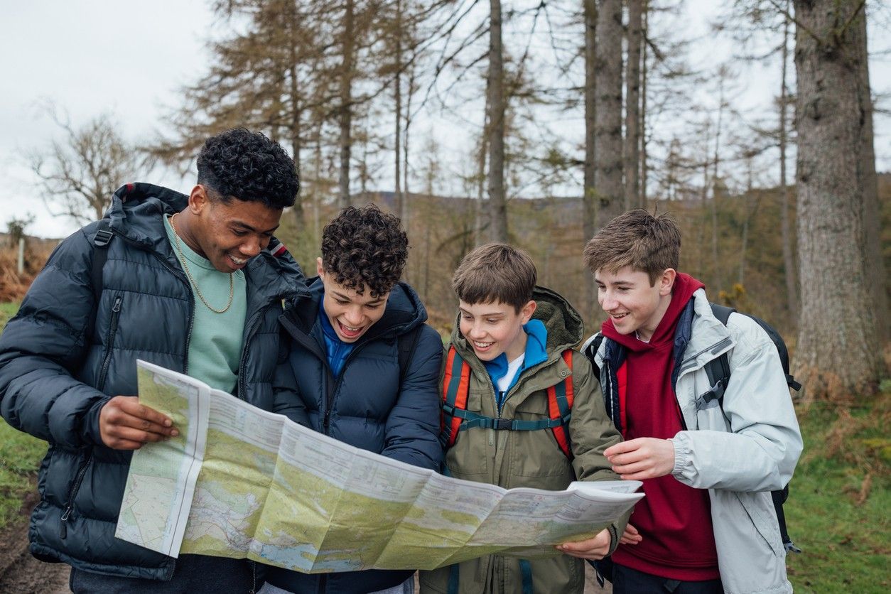 Young people reading a map