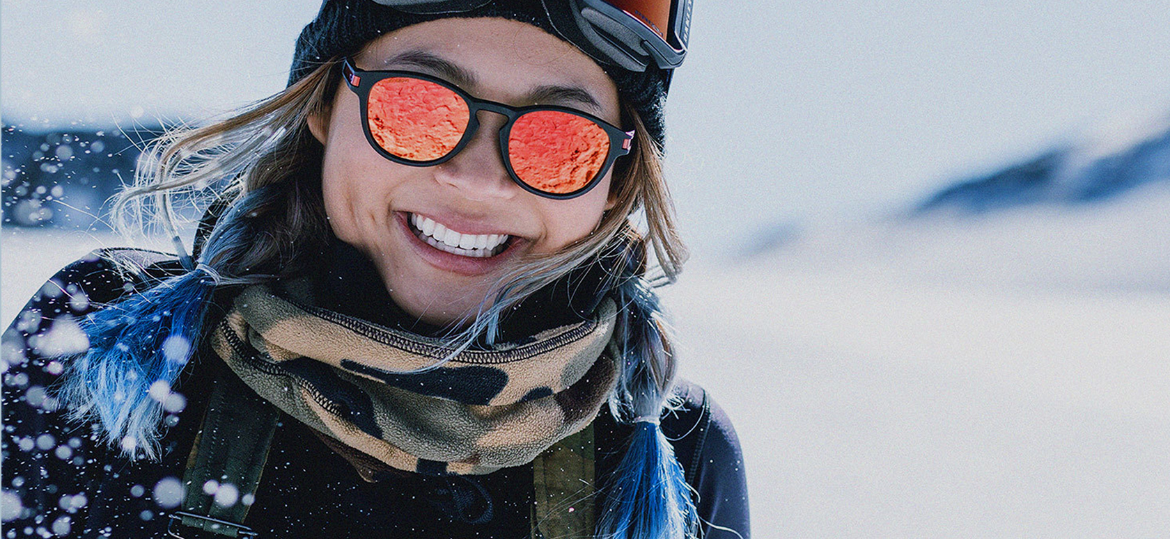 A woman wearing Oakley Sunglasses