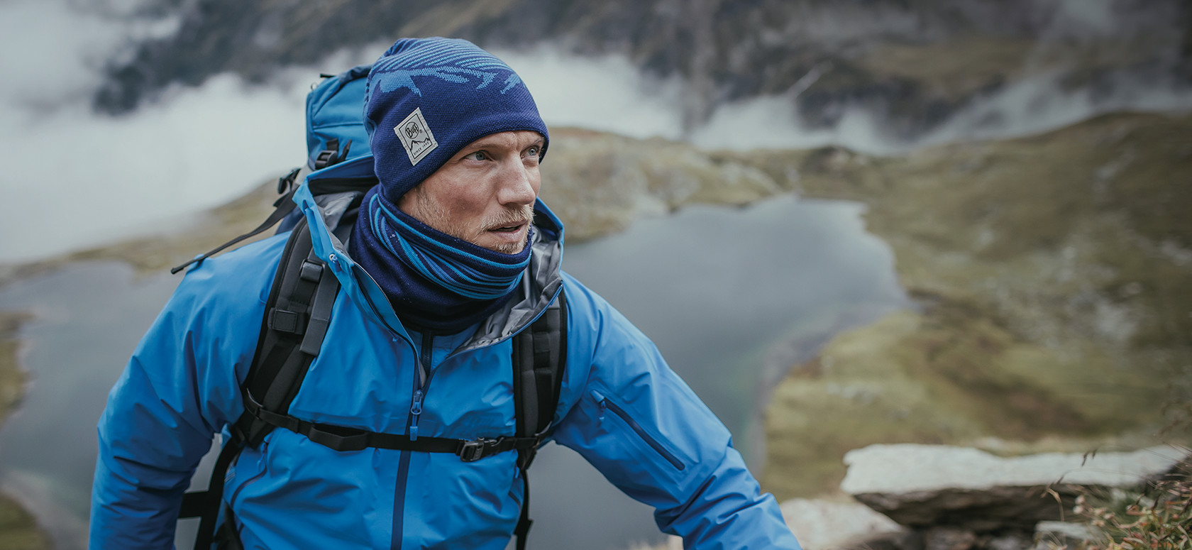 A man wearing a Buff 