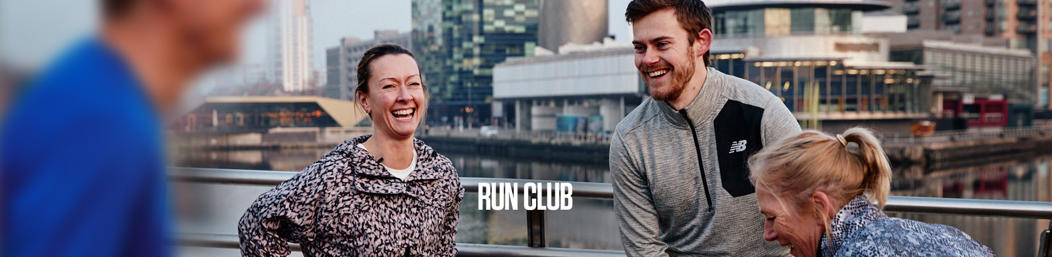 Run Club. A group of people preparing for a run on a street