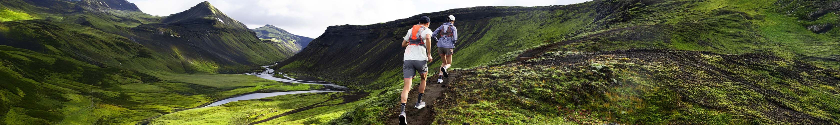 Shop accessories new season. Two runners running on a mountain 