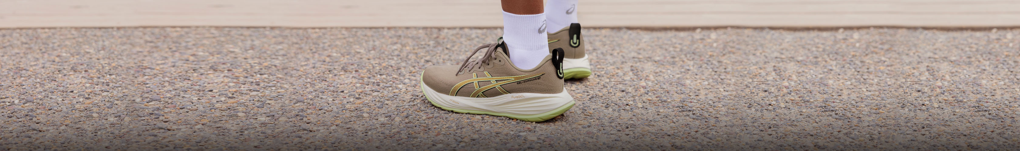 Shop new season Shoes. A person in running shoes standing on a street