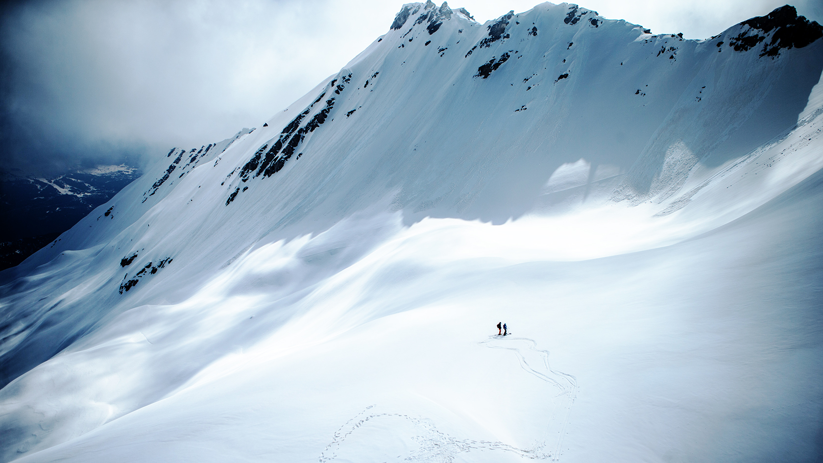 Two people in the snowy mountains 