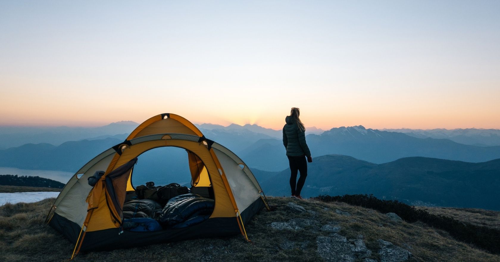 An image of a person wild camping in the mountains 