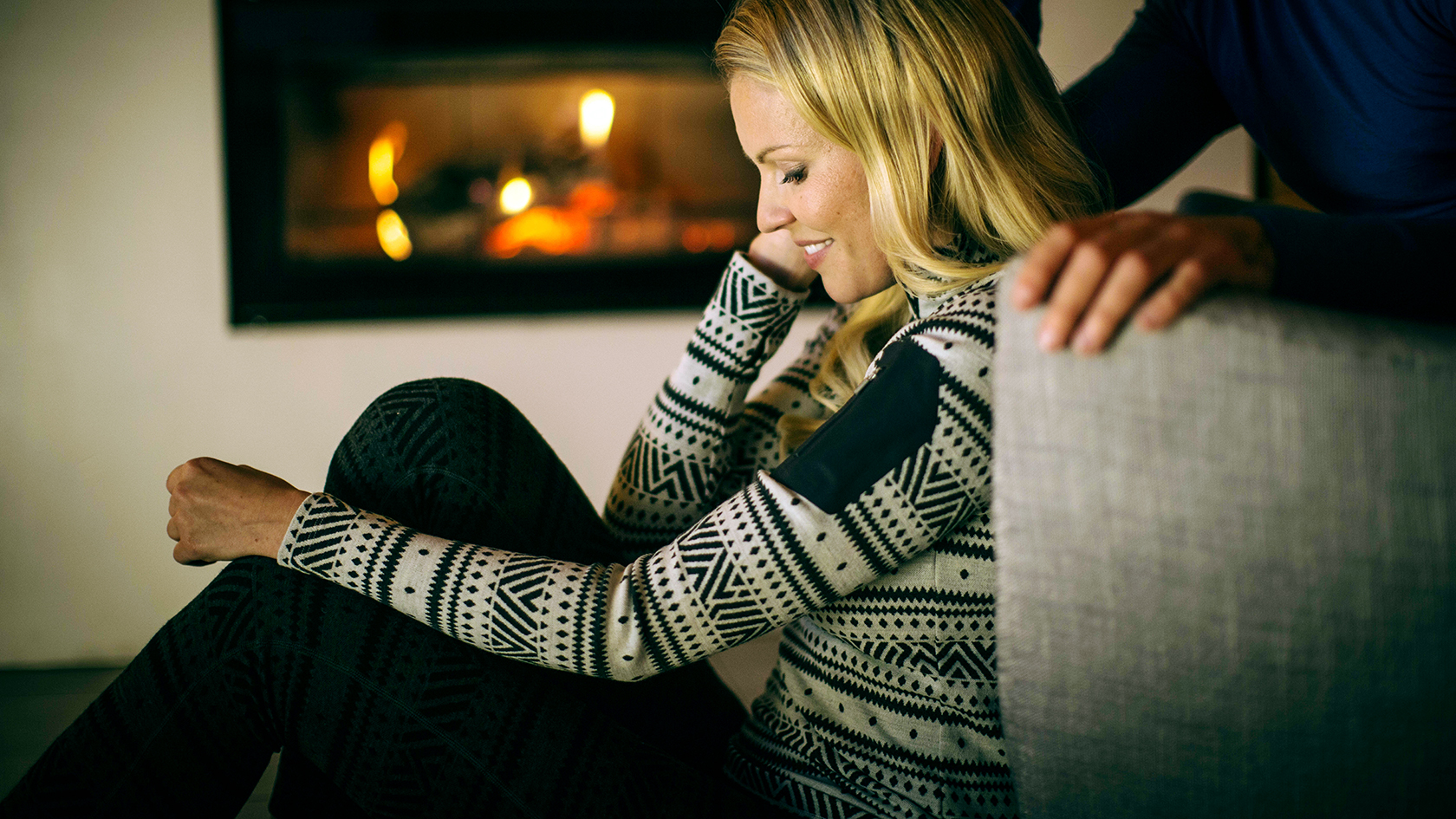 A woman wearing a baselayer in a chalet