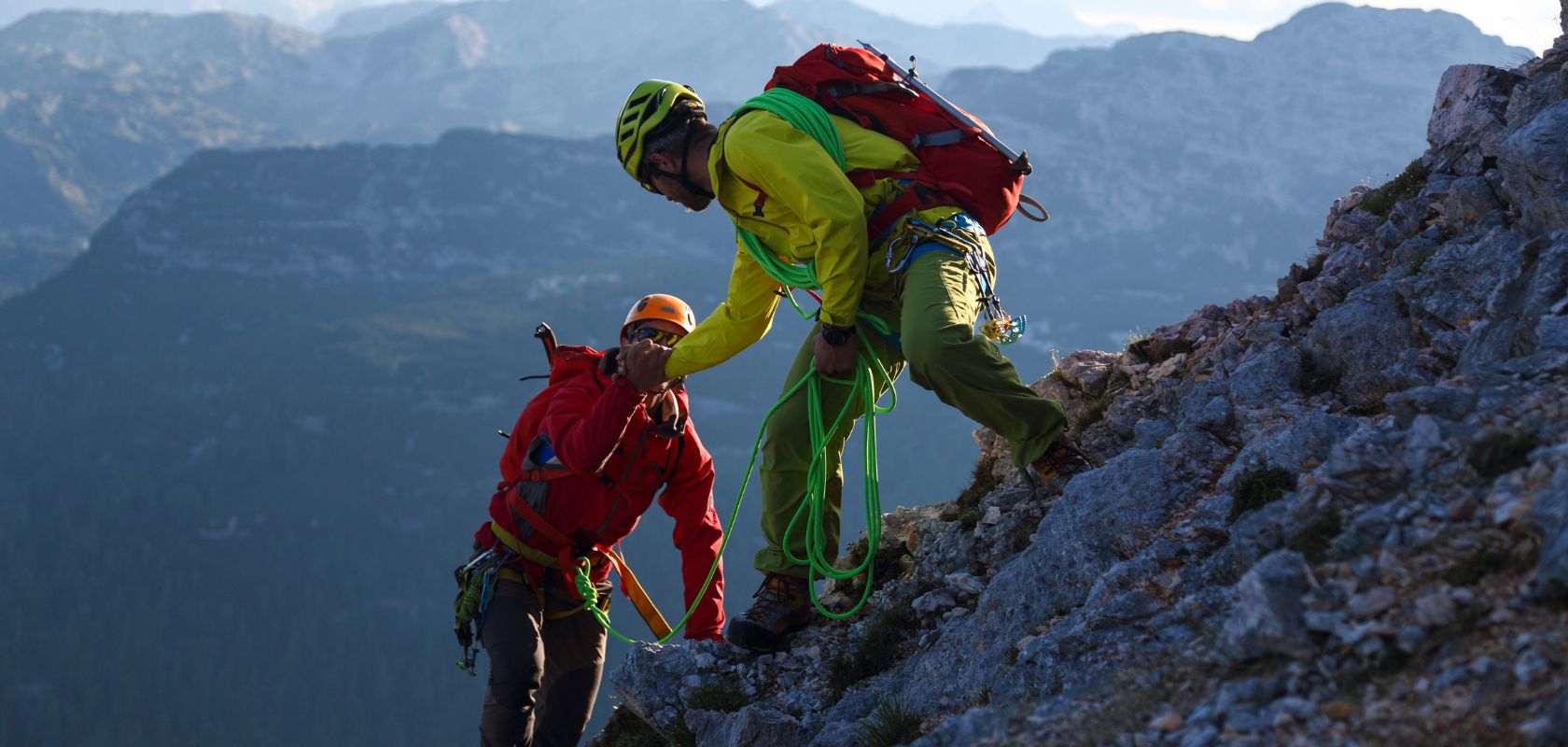 Two people helping each other out on a scramble