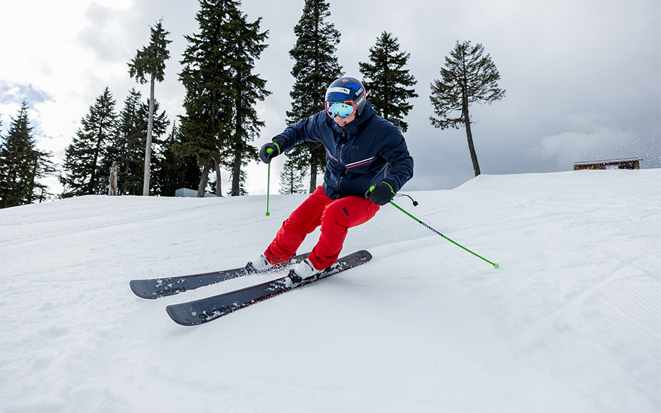 A person skiing in Helly Hansen ski clothing 