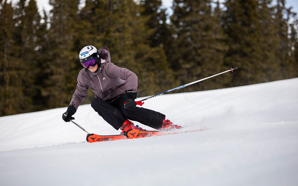 A man skiing in a Helly Hansen ski jacket 