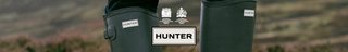 Green Hunter wellies with the Hunter logo in the middle of the image.