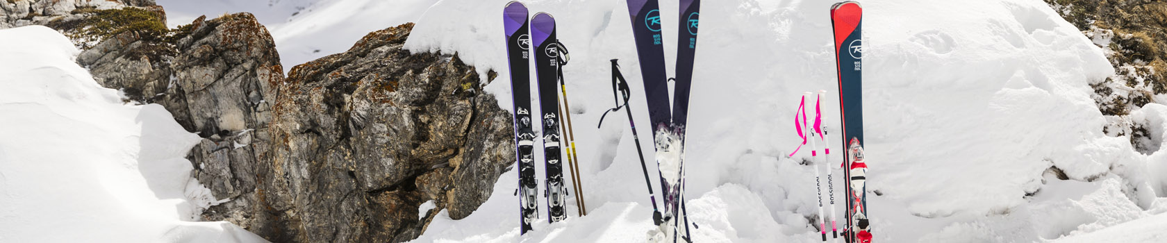 Rossignol skis lined up in the snow
