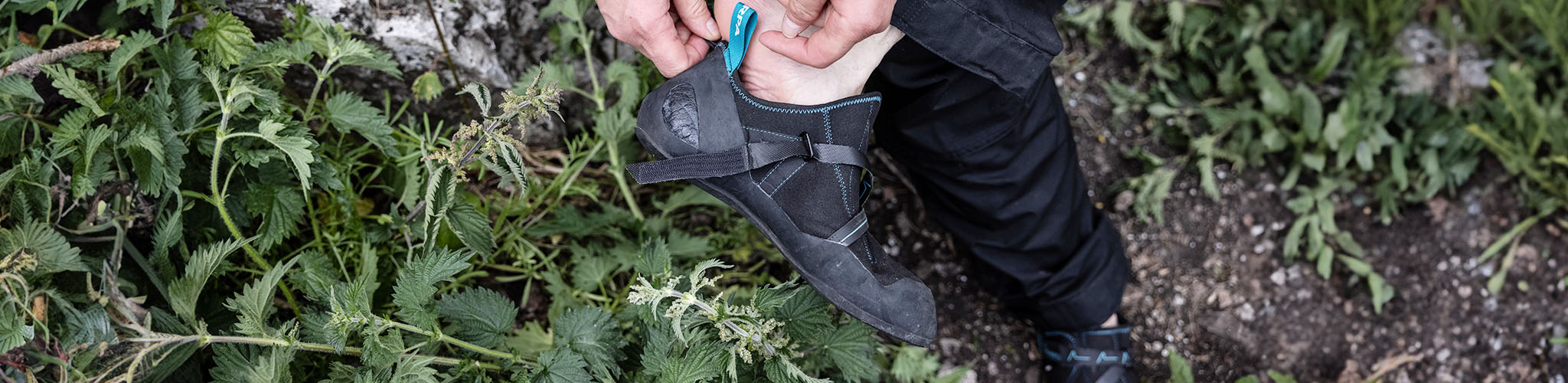 Shop climbing shoes. A person wearing climbing shoes