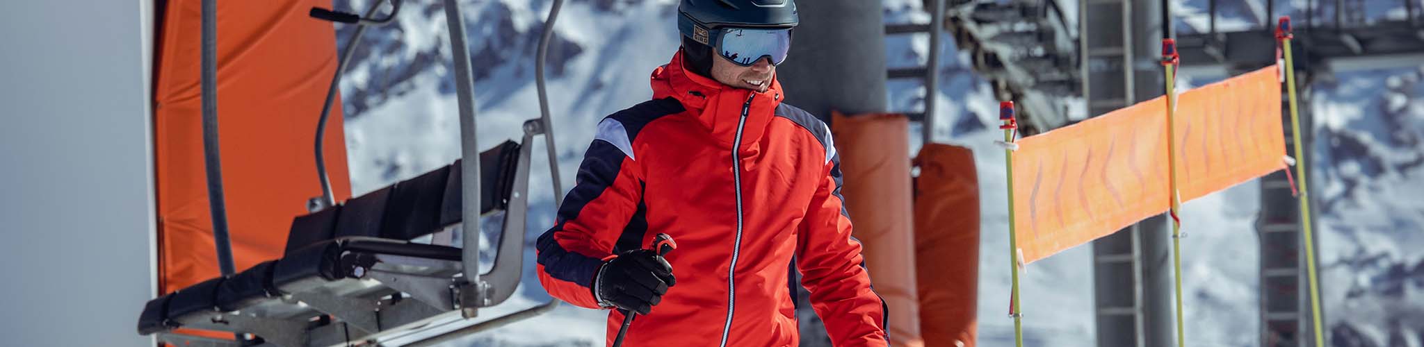 Shop jackets. A man wearing a ski jacket