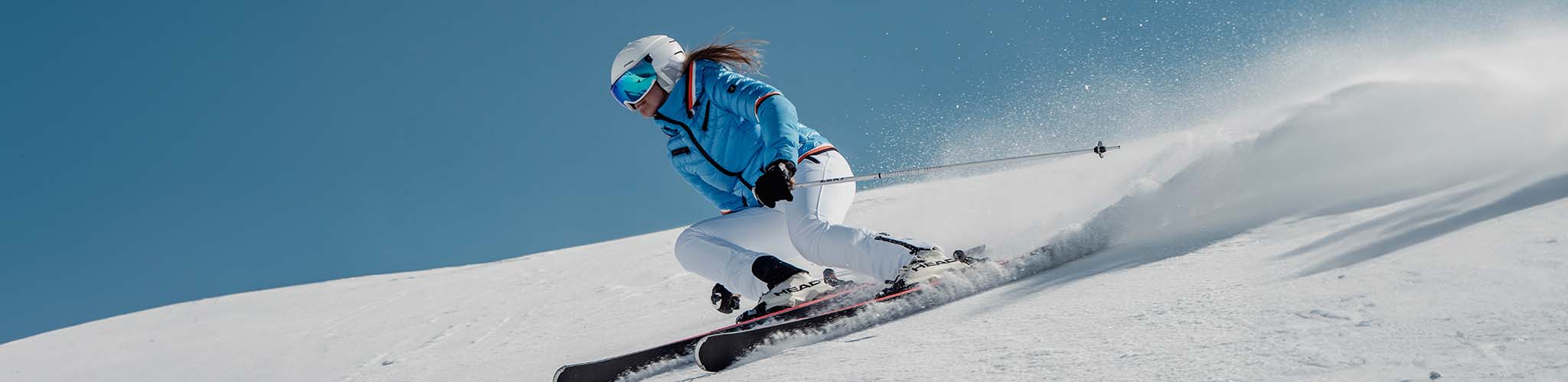 Shop legwear. Woman skiing 