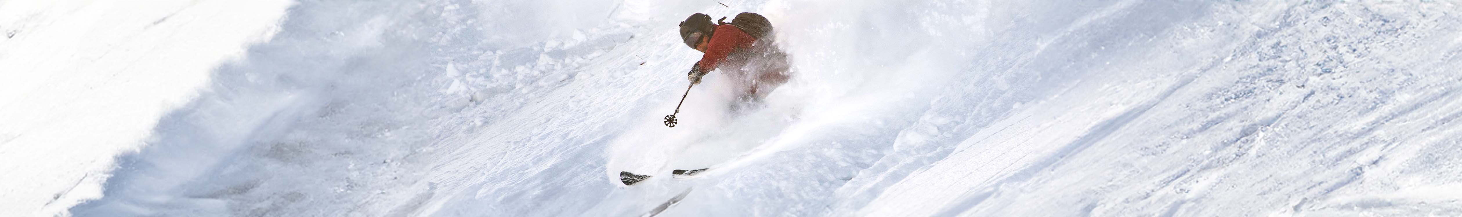 A person skiing down a mountain off piste