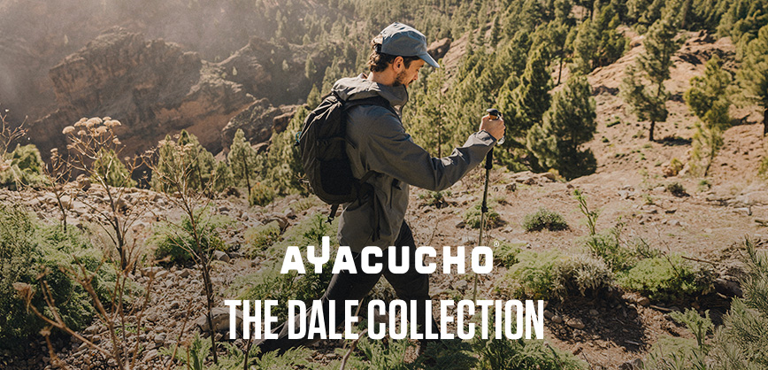 Shop Ayacucho collection. Two people in playful motion in a woodland setting