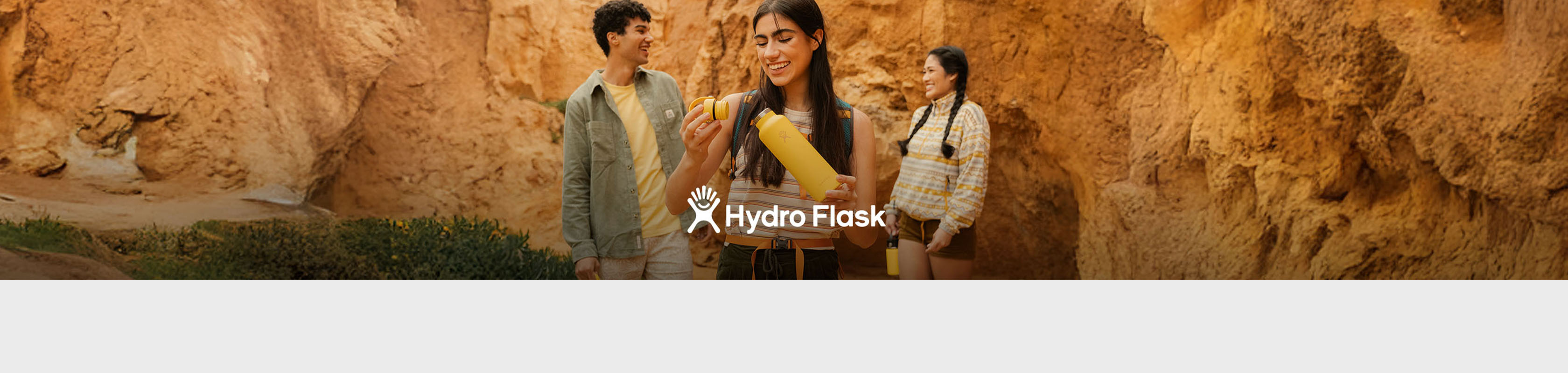 Shop Hydro Flask collection. A woman holding a Hydro Flask