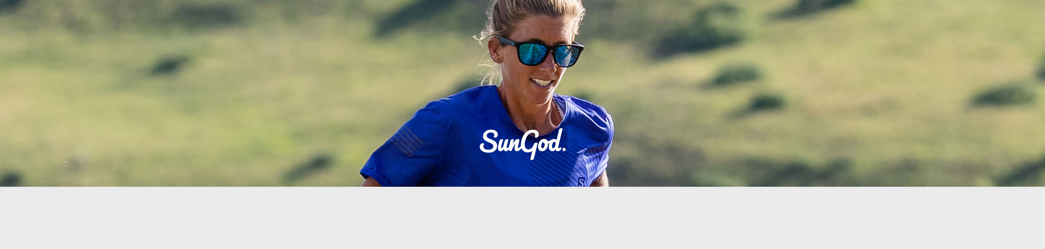 Shop SunGod sunglasses, A woman in blue T-shirt wearing SunGod sunglasses
