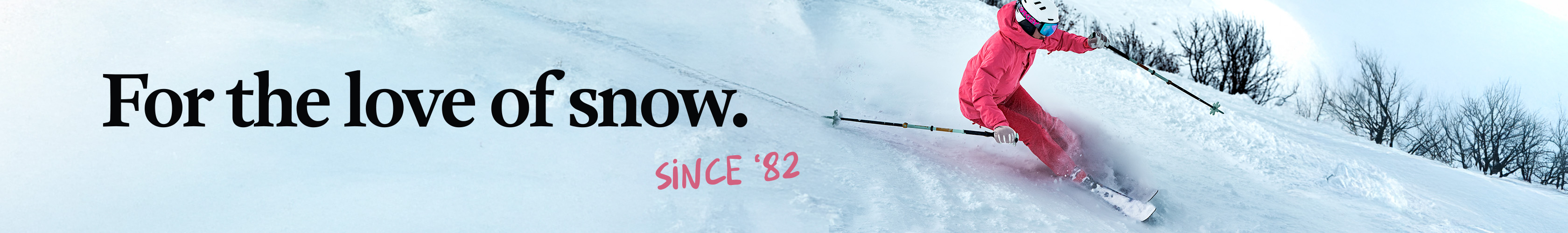 Shop ski new season. A person in red ski outfit is skiing down the mountain