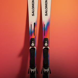 Shop skis. A pair of Salomon skis on peach coloured wall
