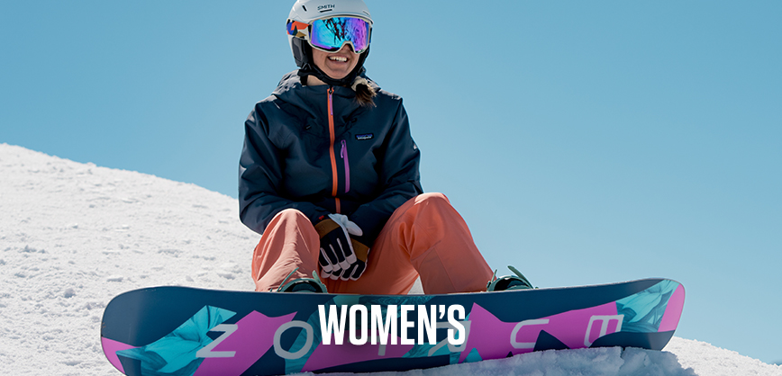 Shop women's new season. A woman in blue jacket and pants skiing down the hill