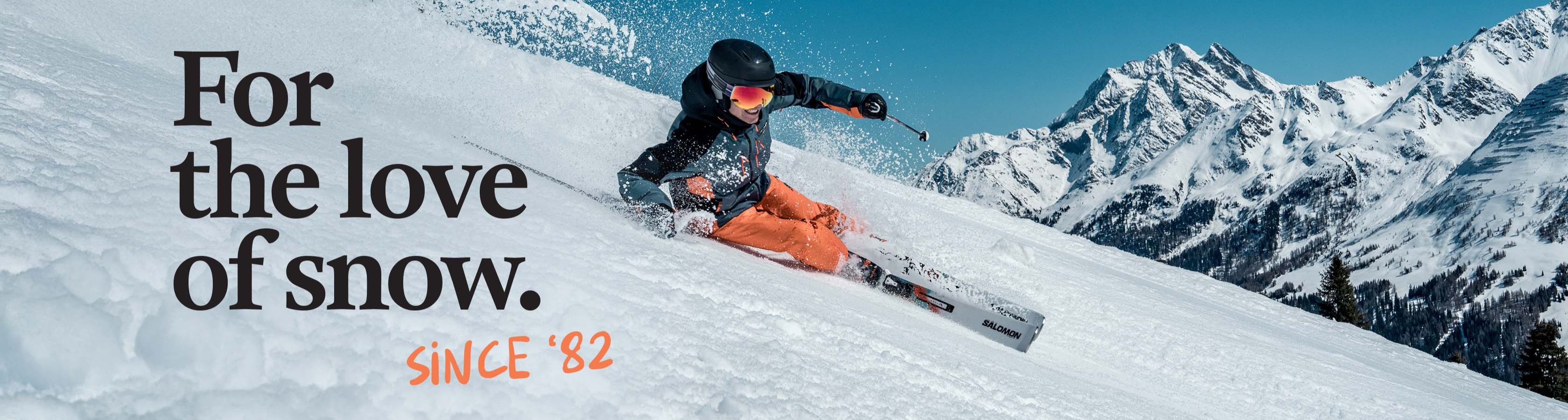 Shop Snowsport new season - For the love of snow since 1982. A man skiing down the mountain