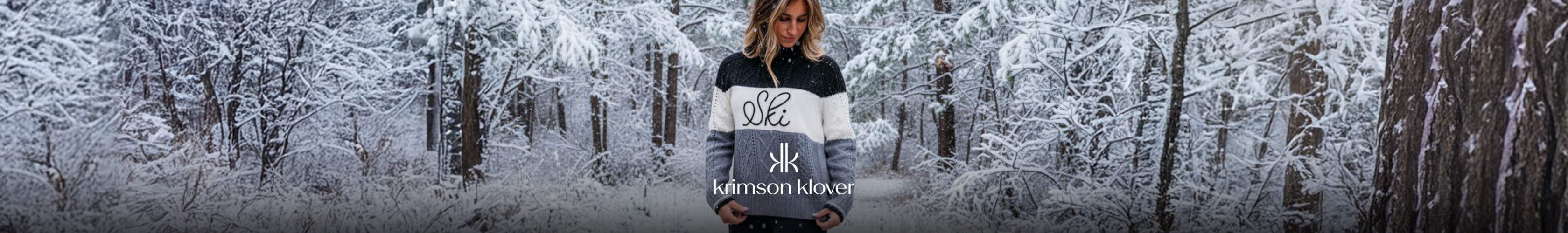 Shop Falke socks. A skiier resting on a snowy slope in Falke socks