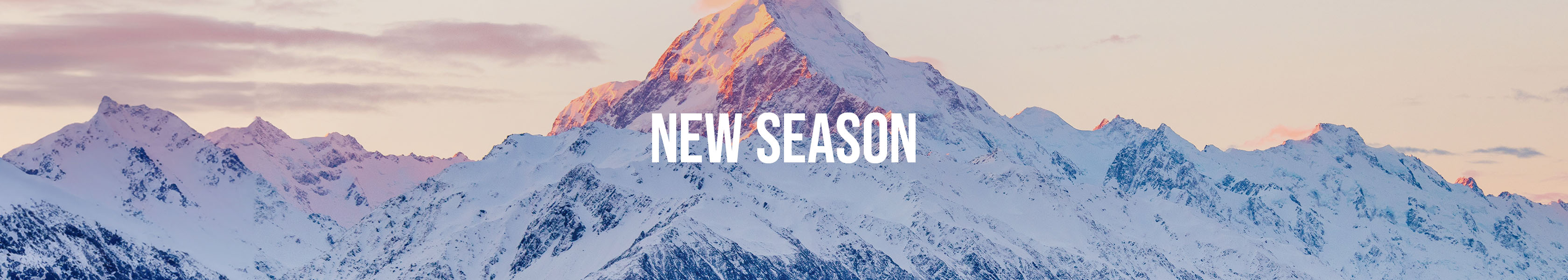 Shop Snow and Rock New Season. New season text over a beautiful mountain view