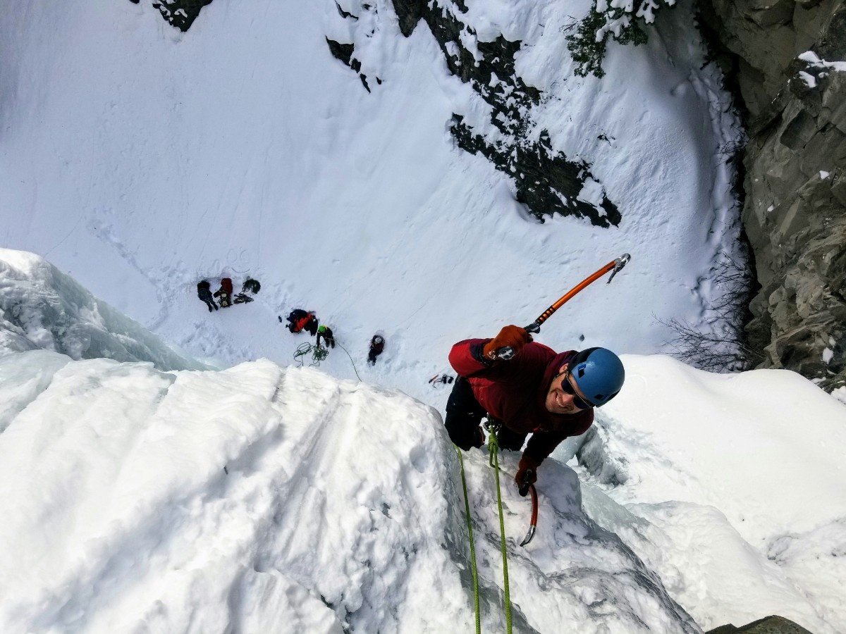 A person completing an ice climb