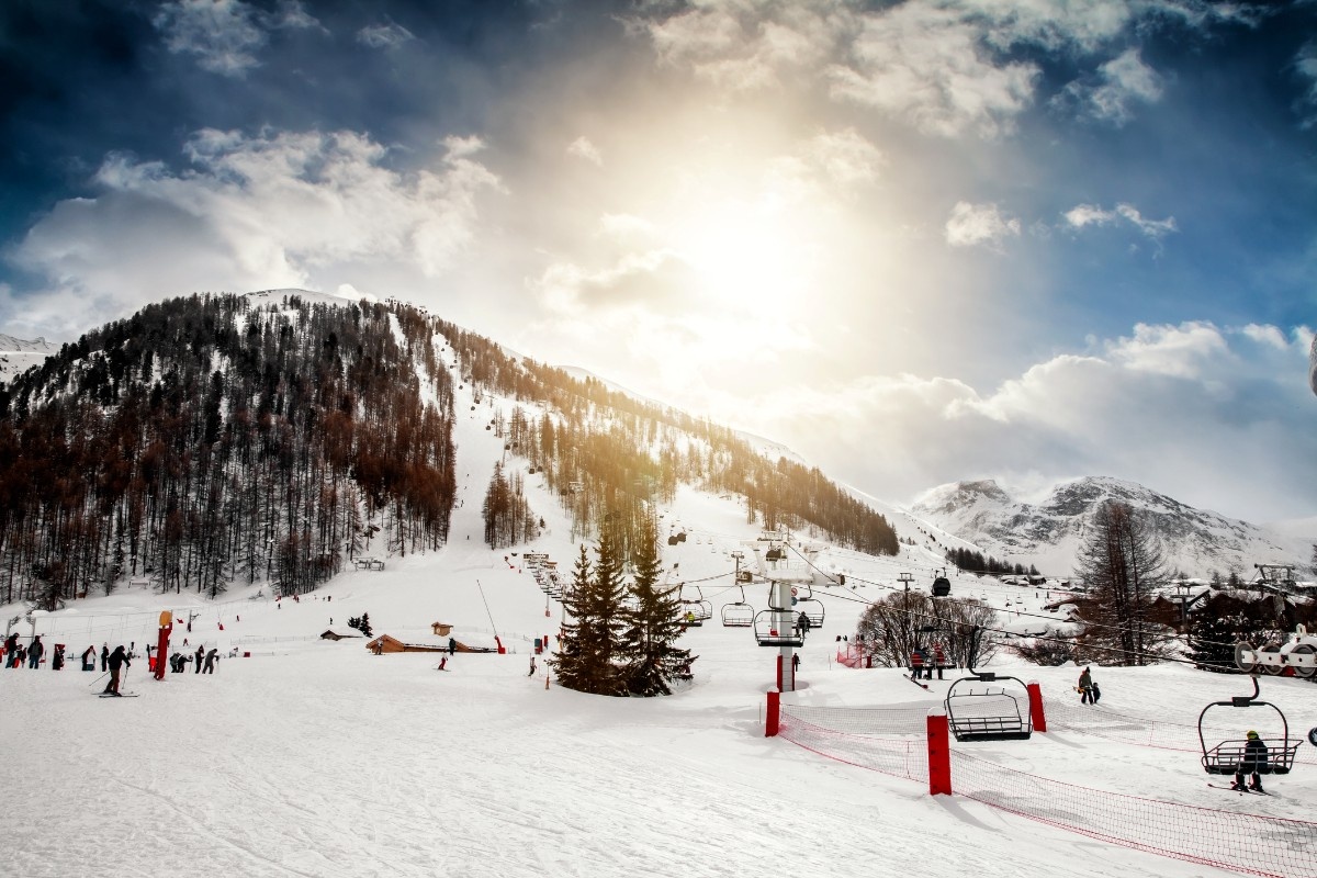People skiing under the ski lifts at Val d'Isere ski resort 