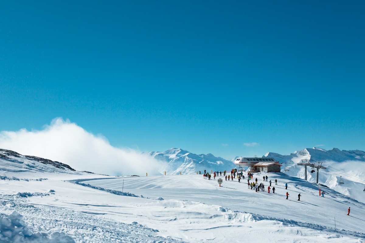 People skiing at the top of the piste at Val d'Isere ski resort 