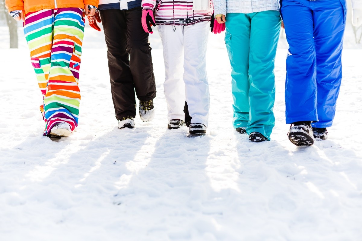 People walking in their salopettes in the snow