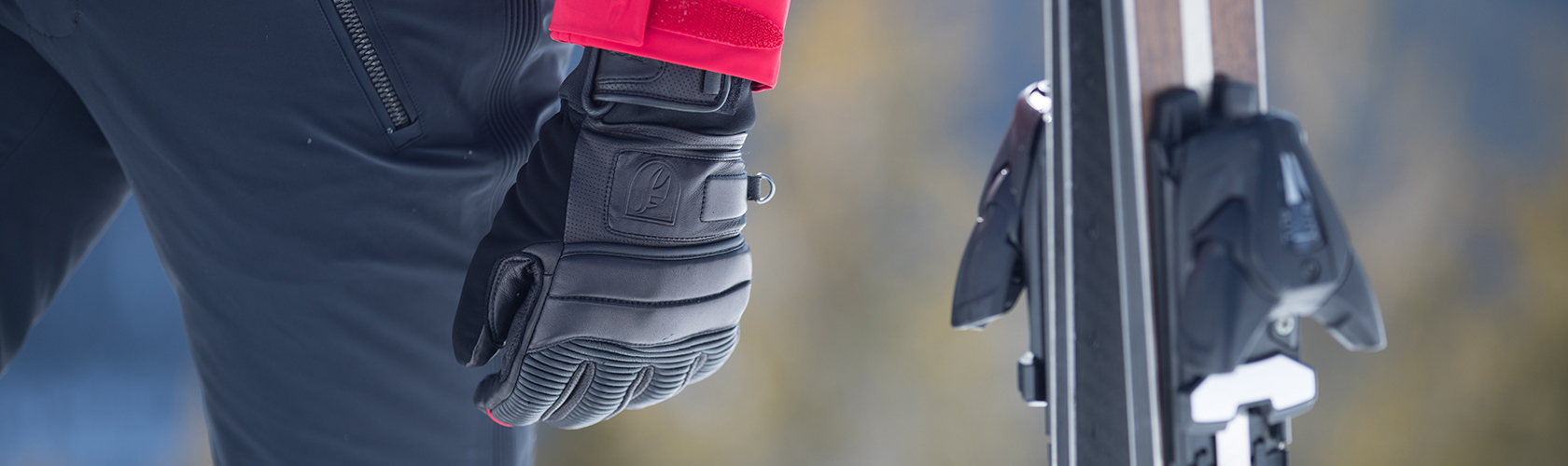 A man wearing ski gloves 