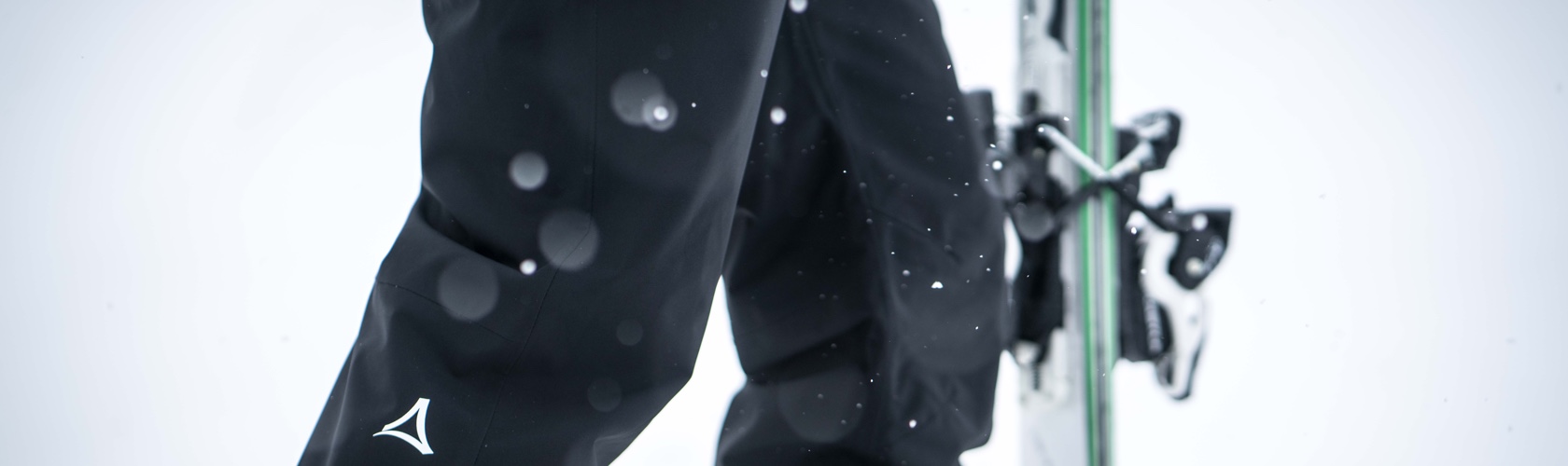 An image of a person wearing salopettes in the snow 